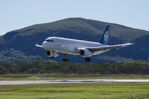 Air New Zealand plane with Sunshine Coasts Mt Coolum in the background