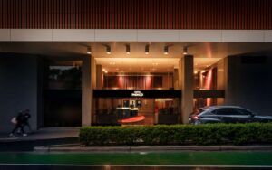 Hotel Indigo Sydney Potts Point_entrance behind the iconic Coca Cola sign