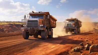Two diesel-electric trucks used in modern mines and quarries for hauling industrial quantities of ore or coal. Used when extra torque is needed for steep hills. Queensland, Australia AI image